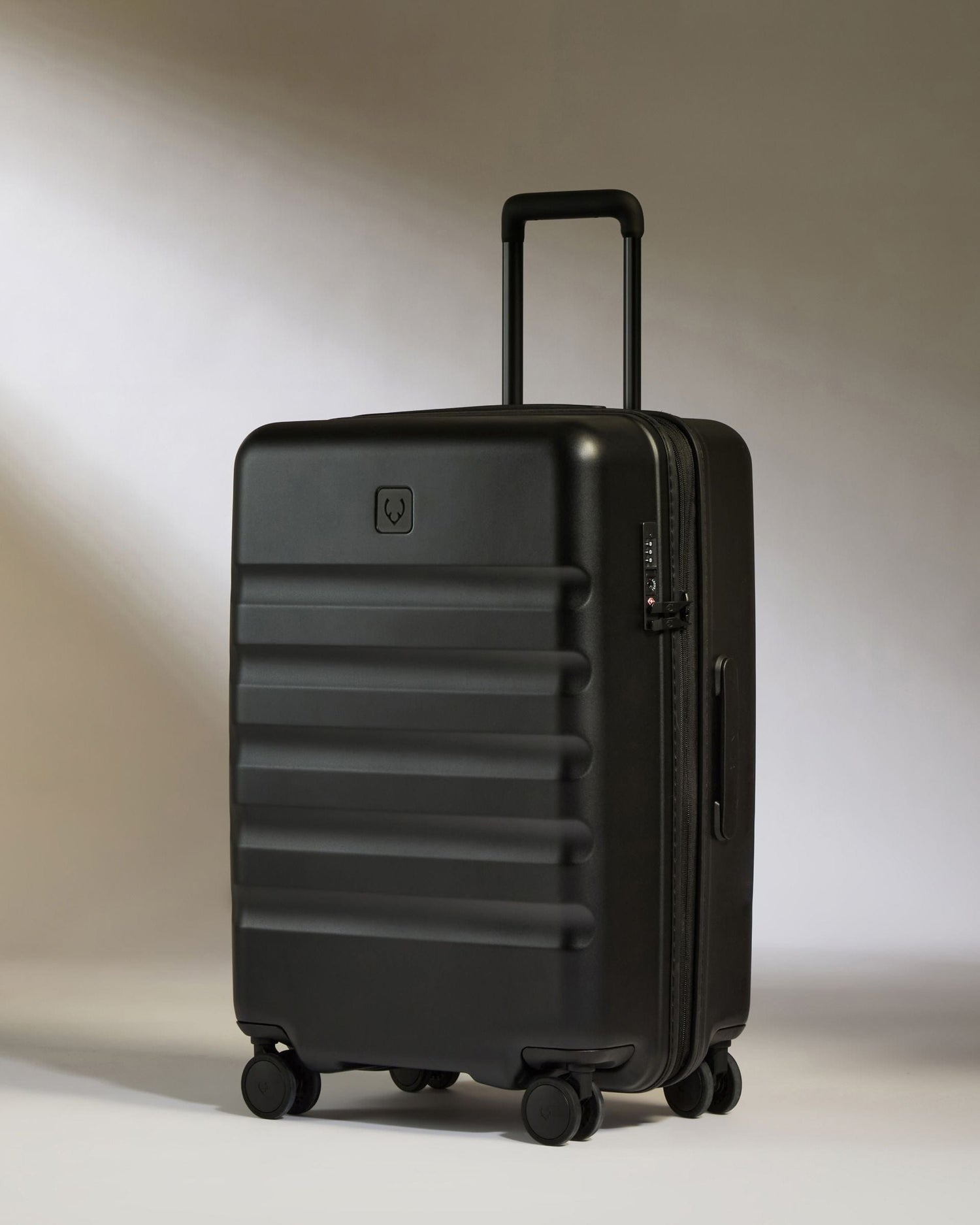 Antler Luggage -  Icon Stripe Medium in Black - Hard Suitcase Icon Stripe Medium Suitcase in Black | Lightweight & Hard Shell Suitcase