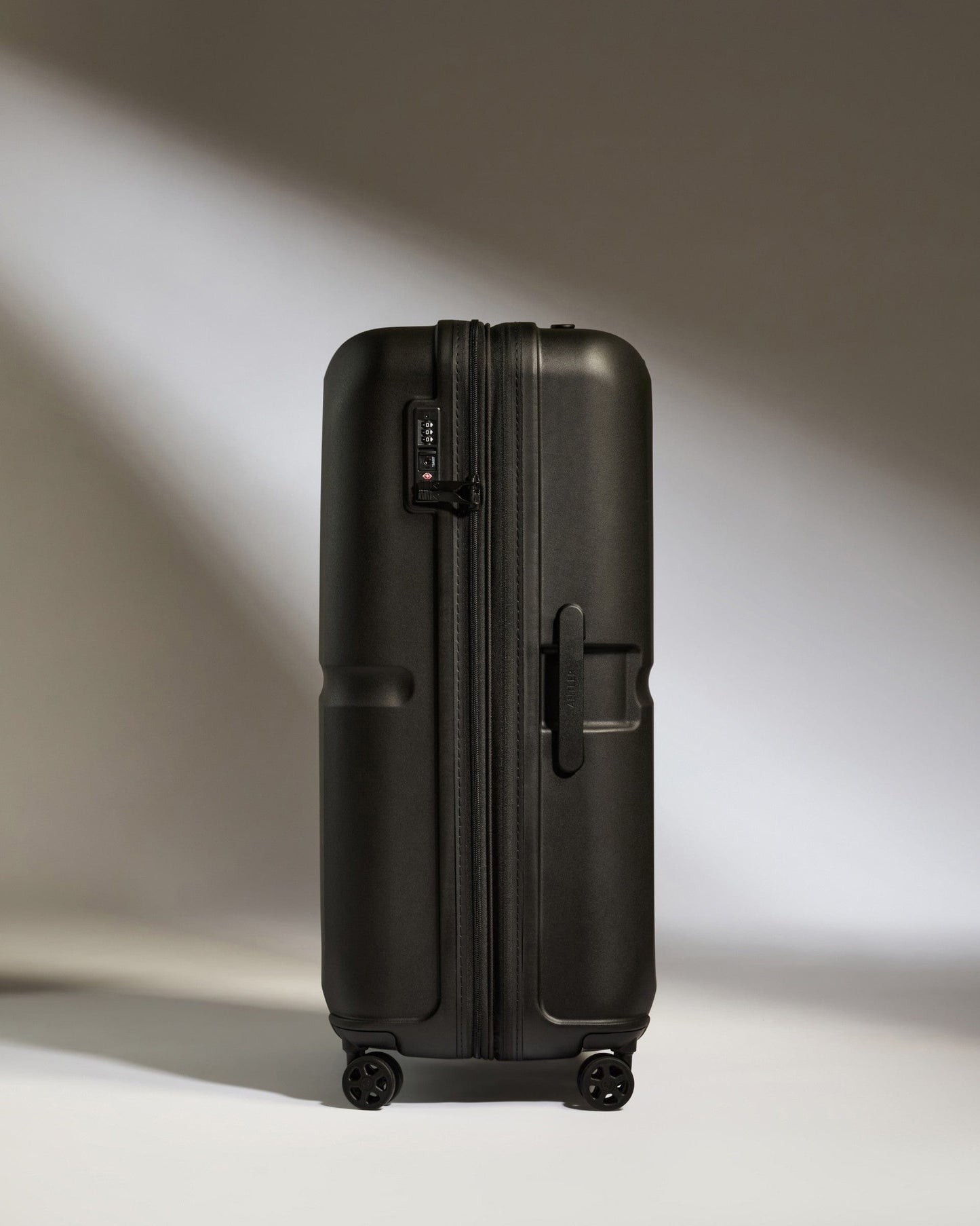 Antler Luggage -  Large Suitcase in Black - Single Stripe - Hard Suitcase Large Suitcase in Black - Single Stripe | Checked Luggage & Large Suitcases