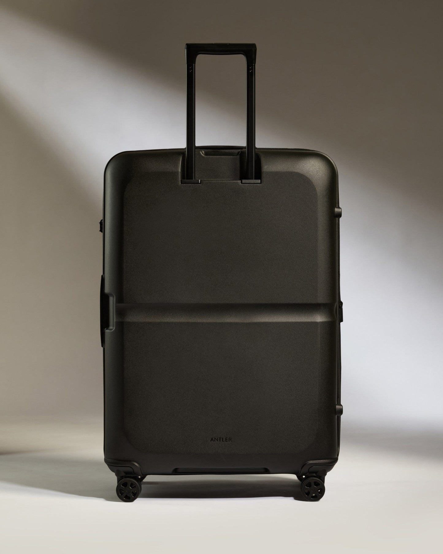 Antler Luggage -  Large Suitcase in Black - Single Stripe - Hard Suitcase Large Suitcase in Black - Single Stripe | Checked Luggage & Large Suitcases