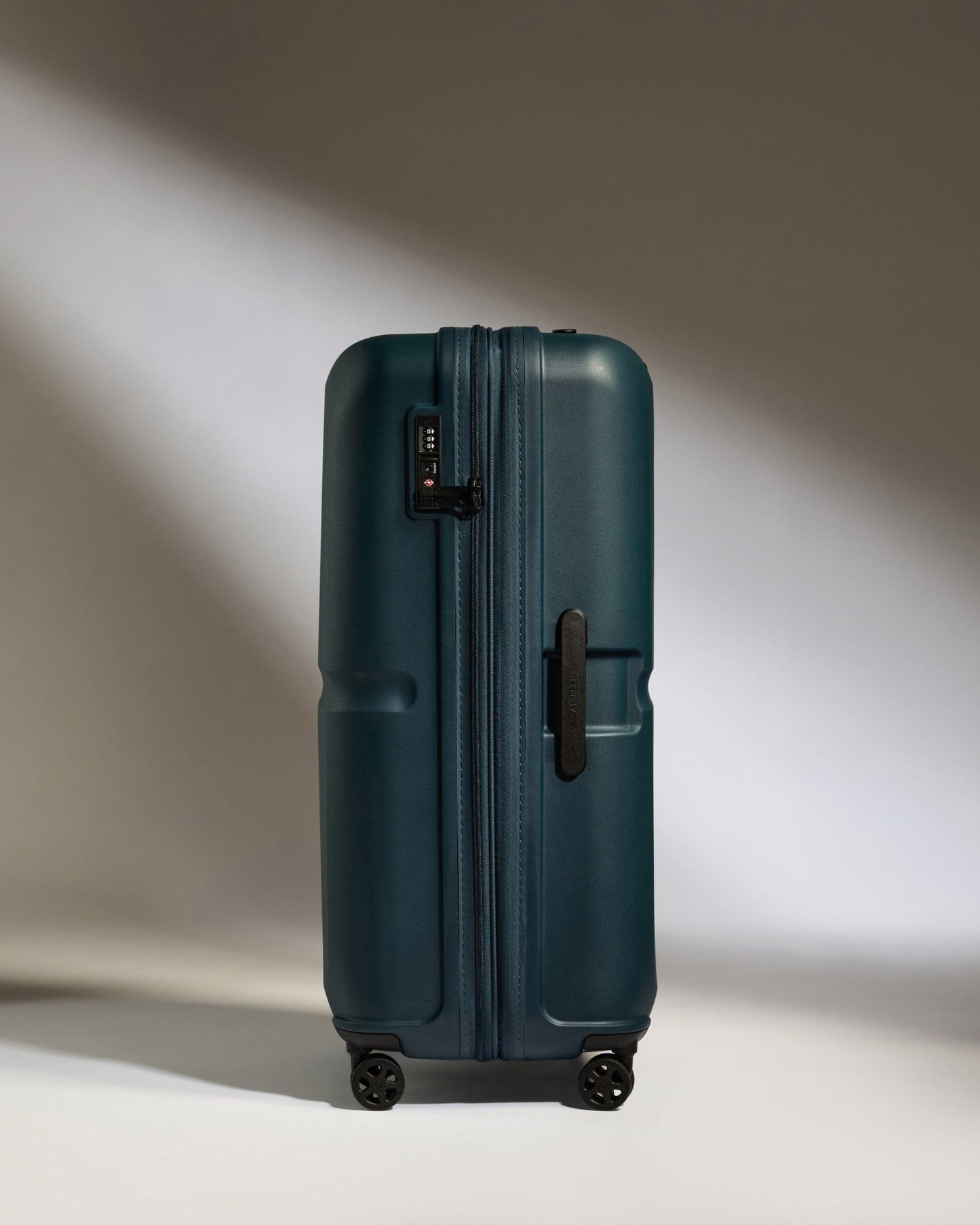 Antler Luggage -  Large Suitcase in Indigo Blue - Single Stripe - Hard Suitcase Large Suitcase in Navy - Single Stripe | Checked Luggage & Large Suitcases