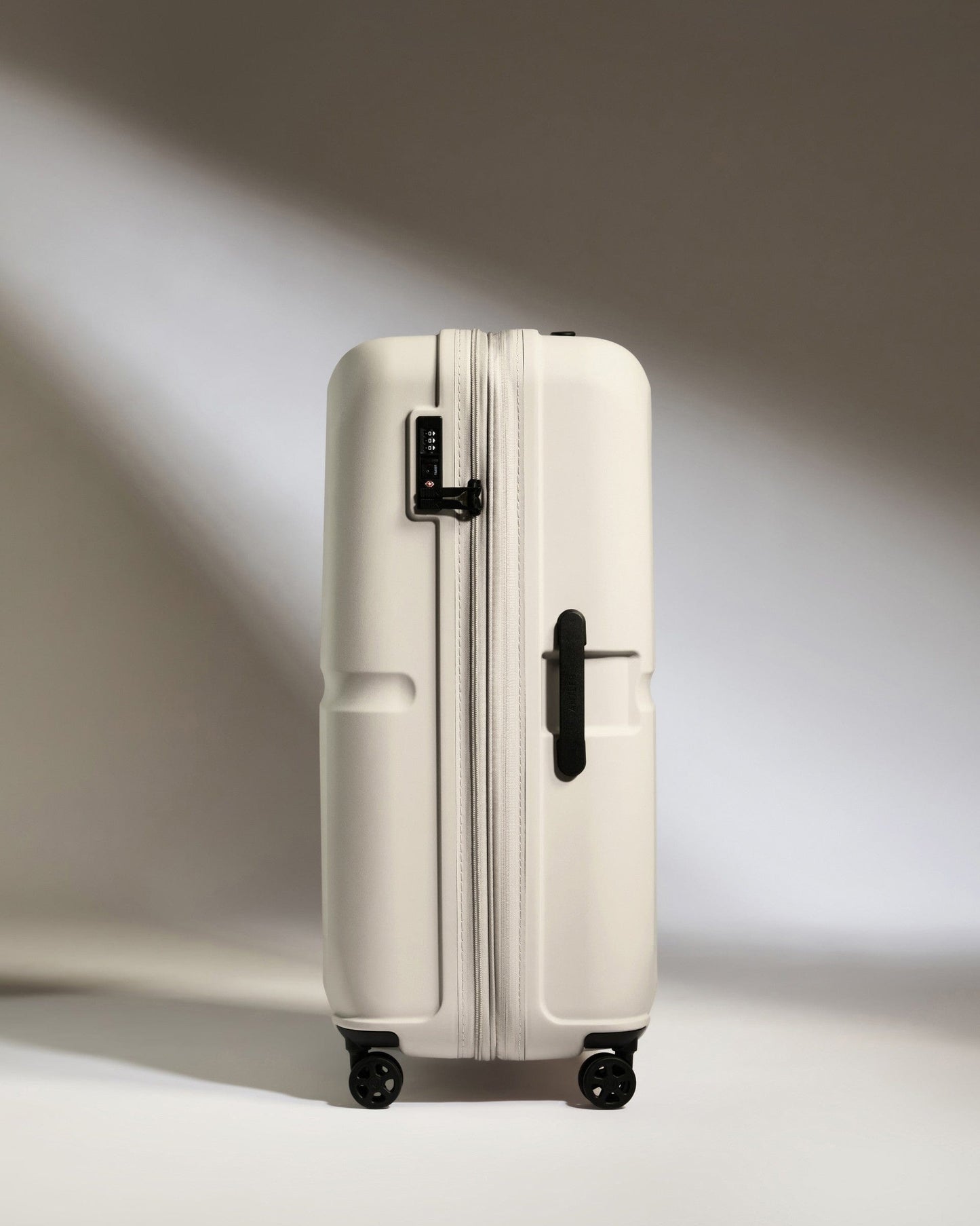 Antler Luggage -  Large Suitcase in Taupe - Single Stripe - Hard Suitcase Large Suitcase in Taupe - Single Stripe | Checked Luggage & Large Suitcases