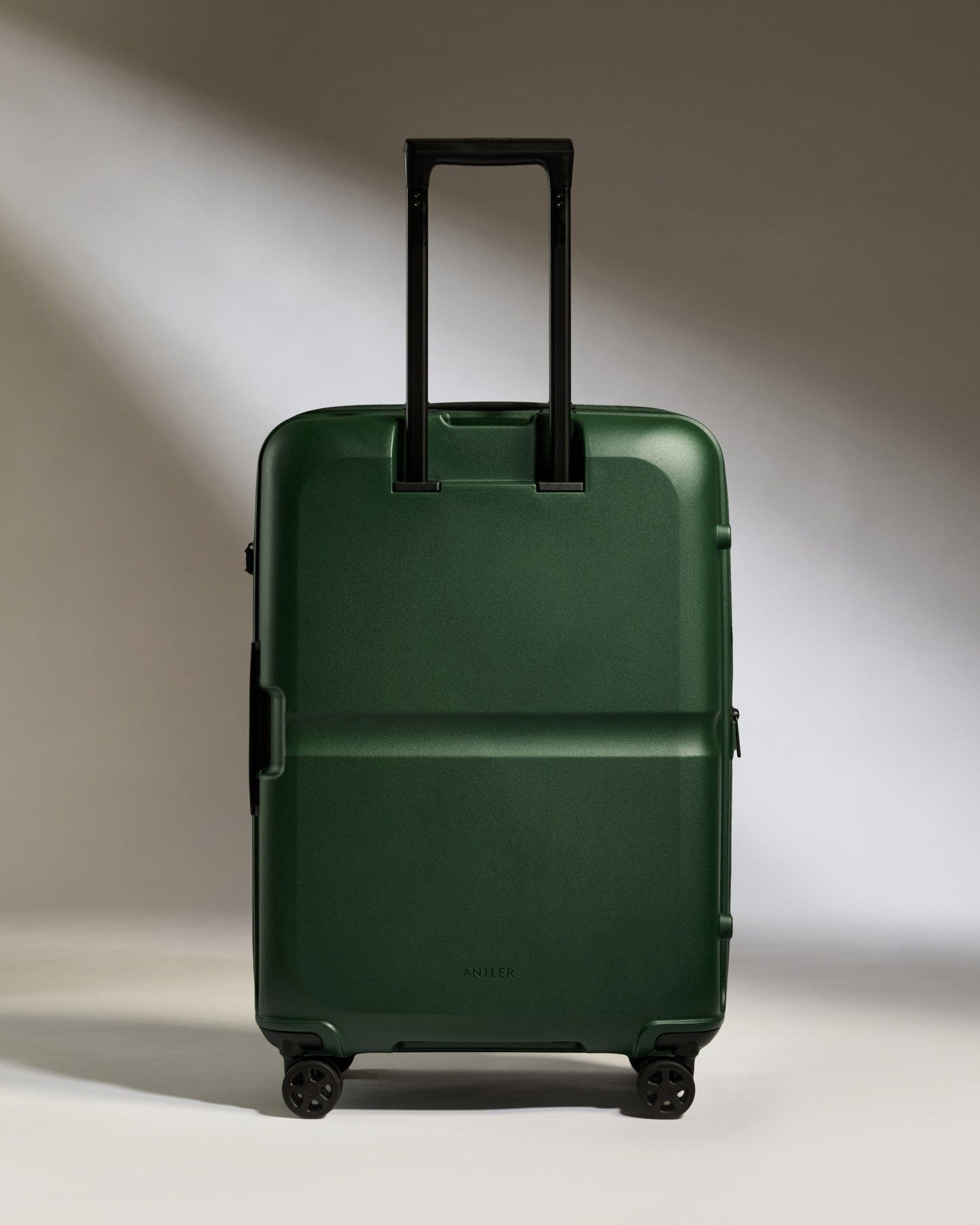 Antler Luggage -  Medium Suitcase in Antler Green - Single Stripe - Hard Suitcase Medium Suitcase in Green - Single Stripe | Check Luggage