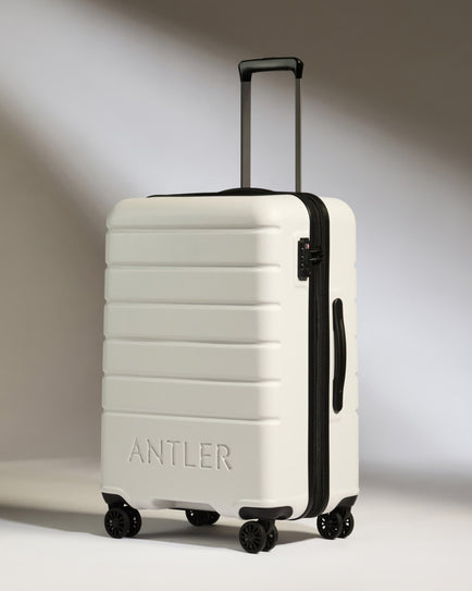 Antler Luggage -  Medium Suitcase in Arctic Grey - Logo - Hard Suitcases Medium Suitcase in Light Grey - Logo | Lightweight Hard Shell Luggage