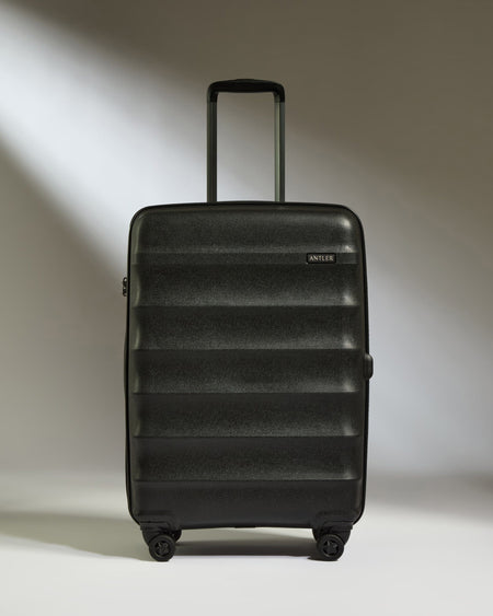 Antler Luggage -  Medium Suitcase in Black - Juno - Hard Suitcase Medium Suitcase in Black - Juno | Checked Luggage & Medium Suitcases