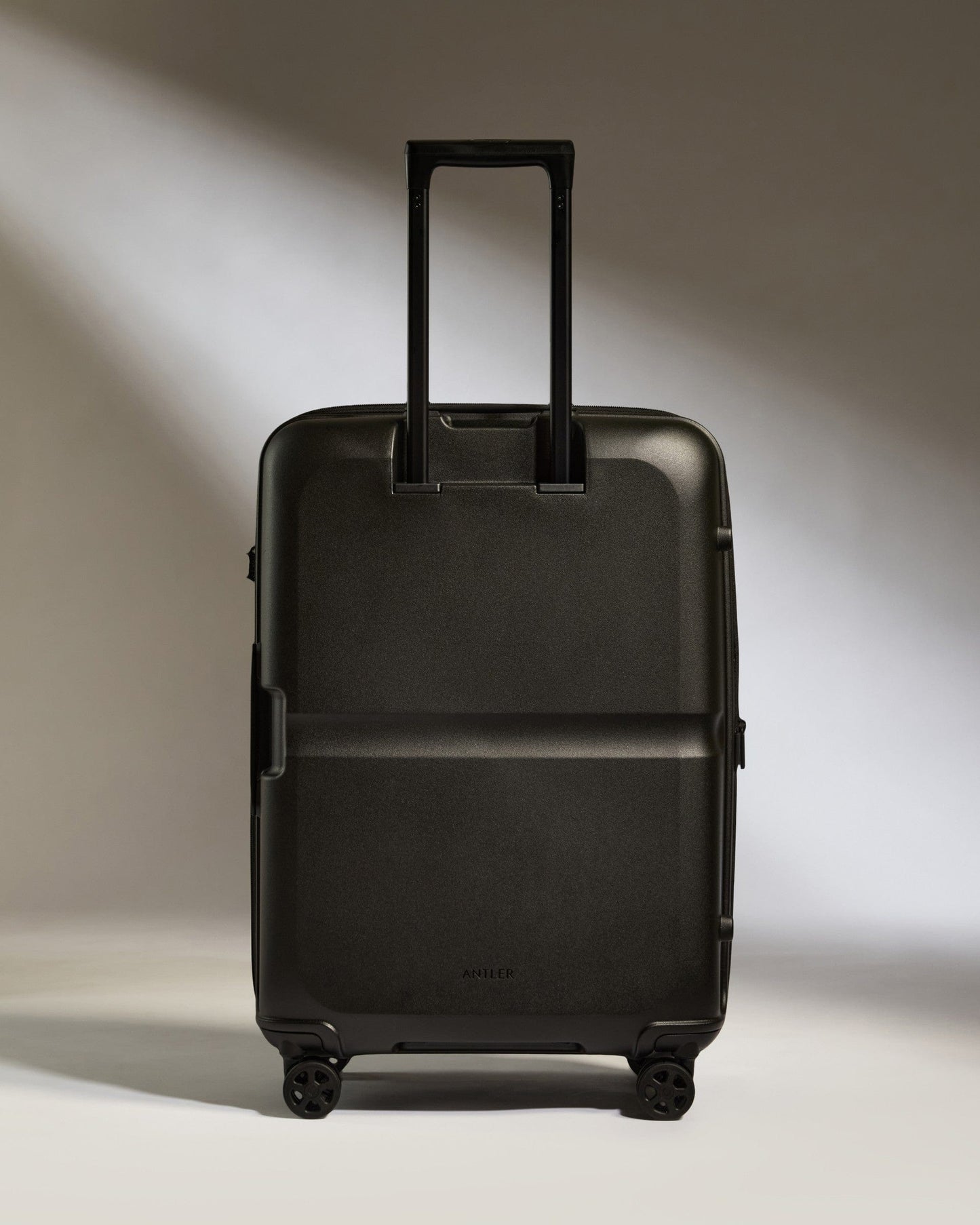 Antler Luggage -  Medium Suitcase in Black - Single Stripe - Hard Suitcase Medium Suitcase in Black - Single Stripe | Check Luggage