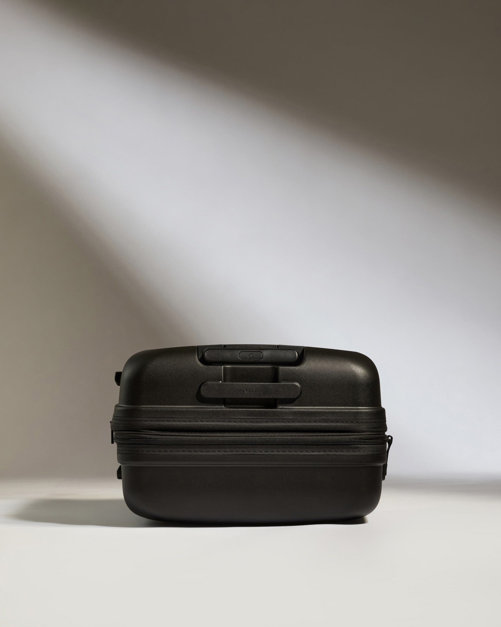 Antler Luggage -  Medium Suitcase in Black - Single Stripe - Hard Suitcase Medium Suitcase in Black - Single Stripe | Check Luggage