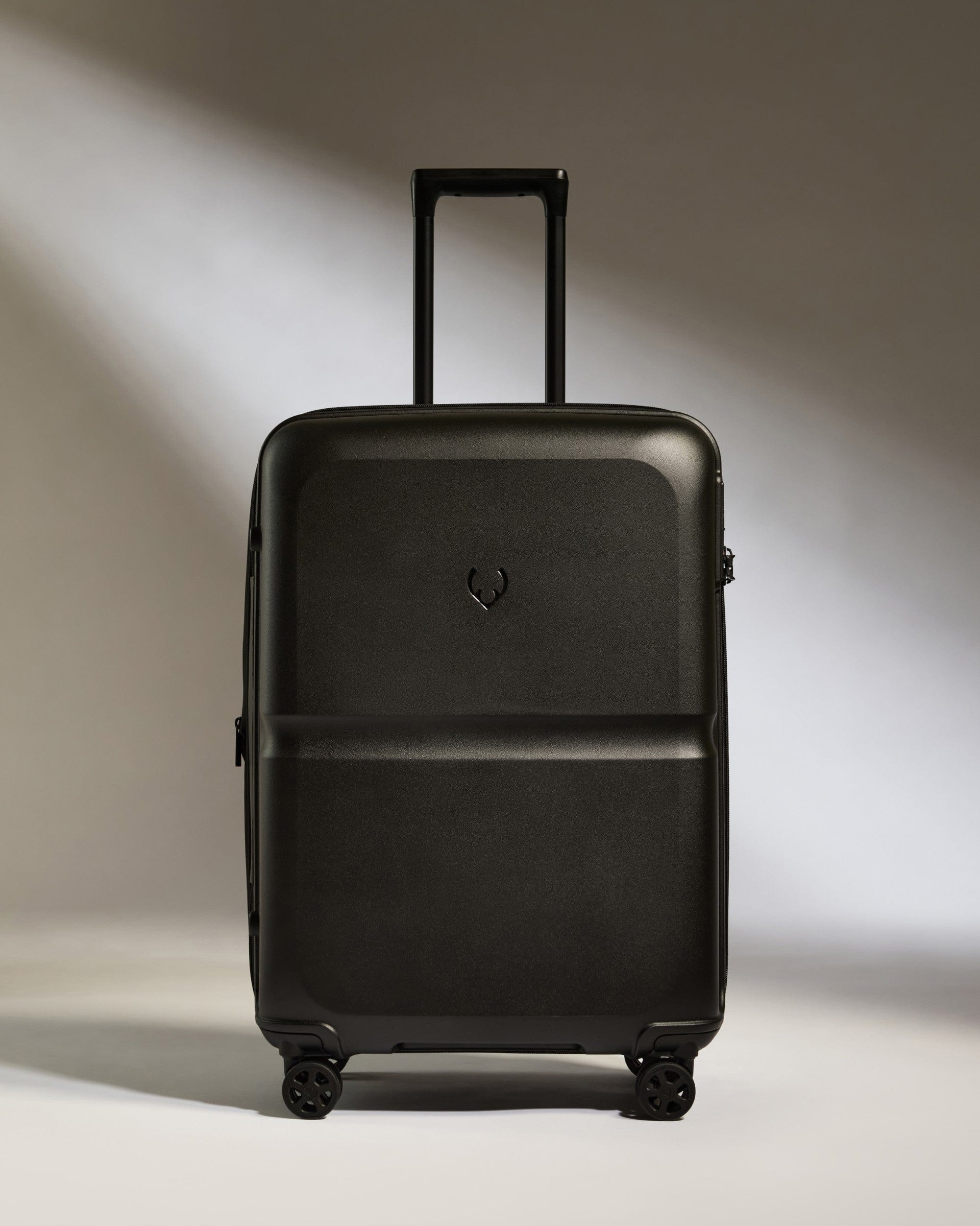 Antler Luggage -  Medium Suitcase in Black - Single Stripe - Hard Suitcase Medium Suitcase in Black - Single Stripe | Check Luggage