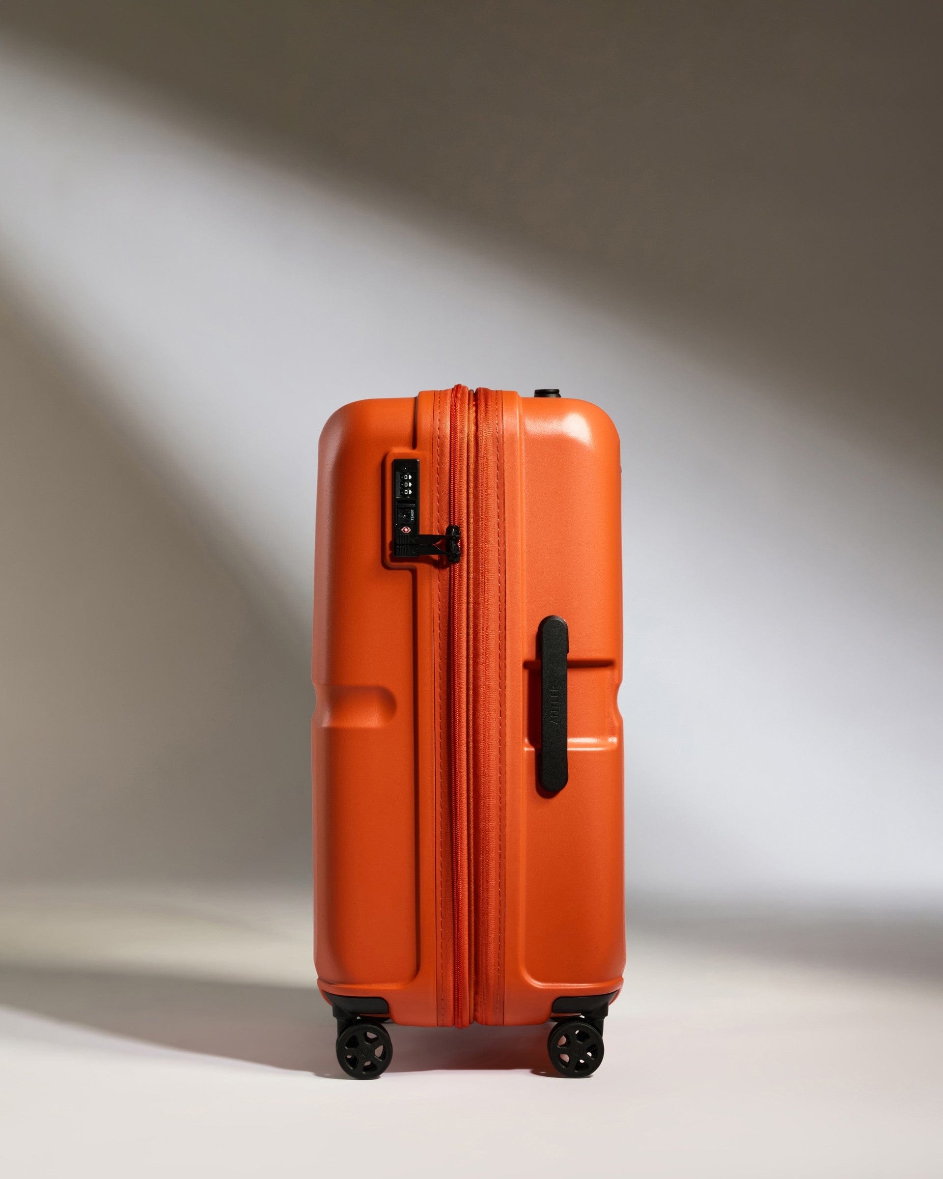 Antler Luggage -  Medium Suitcase in Ember Orange - Single Stripe - Hard Suitcase Medium Suitcase in Orange - Single Stripe | Check Luggage