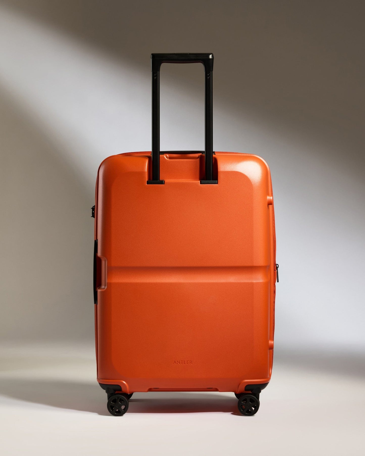 Antler Luggage -  Medium Suitcase in Ember Orange - Single Stripe - Hard Suitcase Medium Suitcase in Orange - Single Stripe | Check Luggage