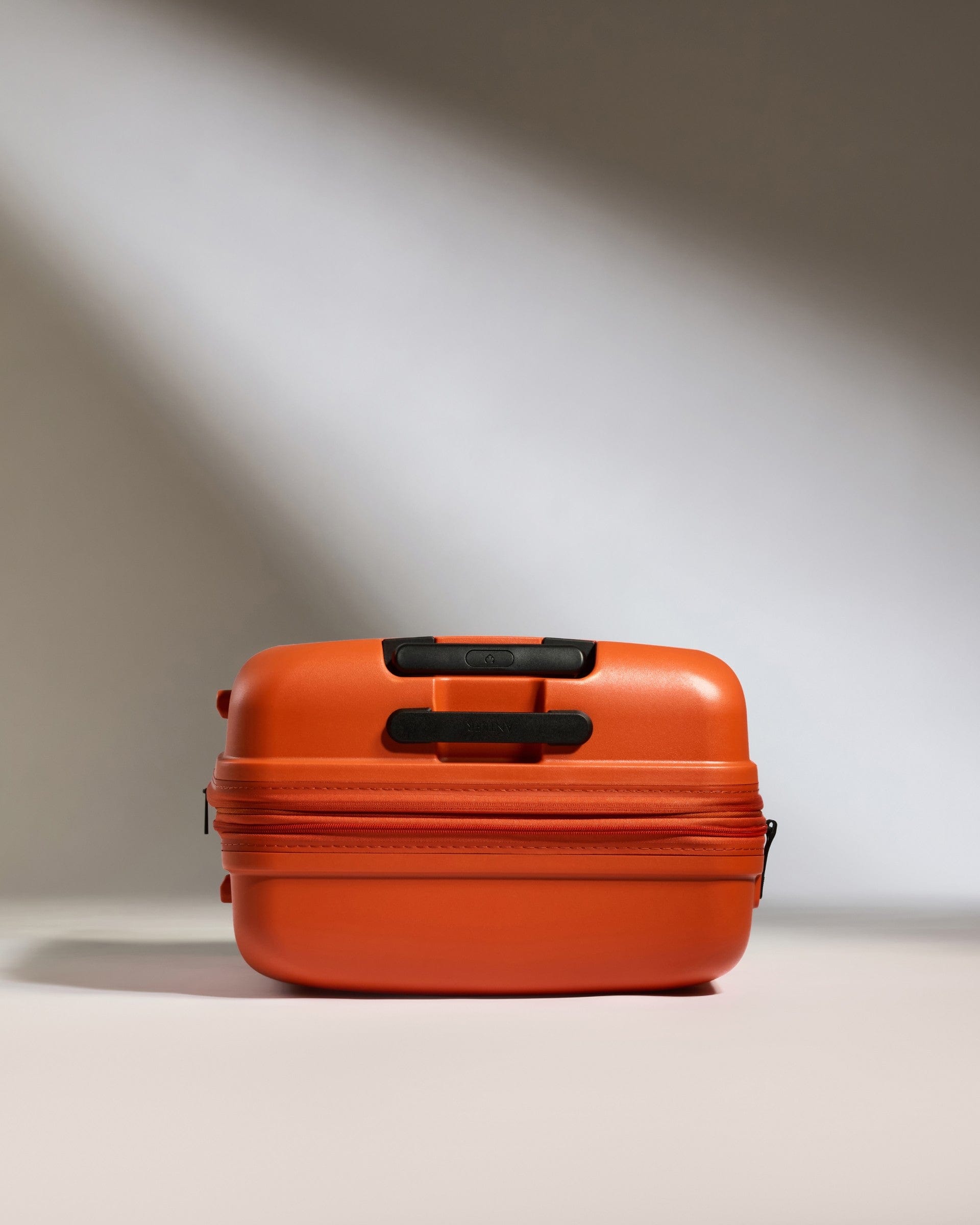 Antler Luggage -  Medium Suitcase in Ember Orange - Single Stripe - Hard Suitcase Medium Suitcase in Orange - Single Stripe | Check Luggage