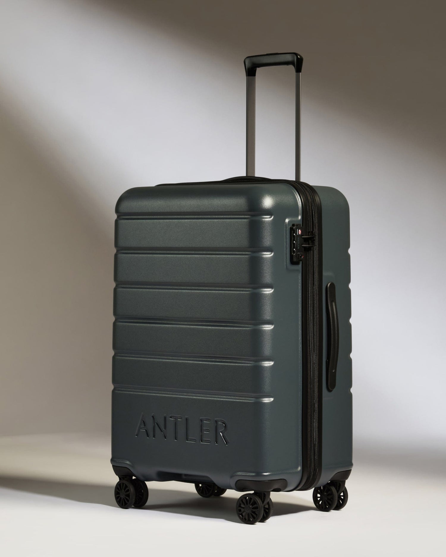 Antler Luggage -  Medium Suitcase in Granite Grey - Logo - Hard Suitcases Medium Suitcase in Grey - Logo | Lightweight Hard Shell Luggage