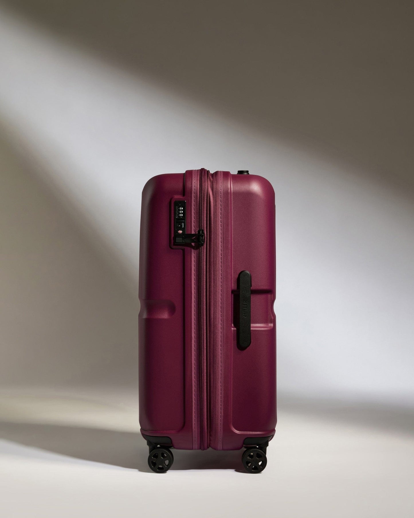 Antler Luggage -  Medium Suitcase in Heather Purple - Single Stripe - Hard Suitcase Medium Suitcase in Purple - Single Stripe | Check Luggage