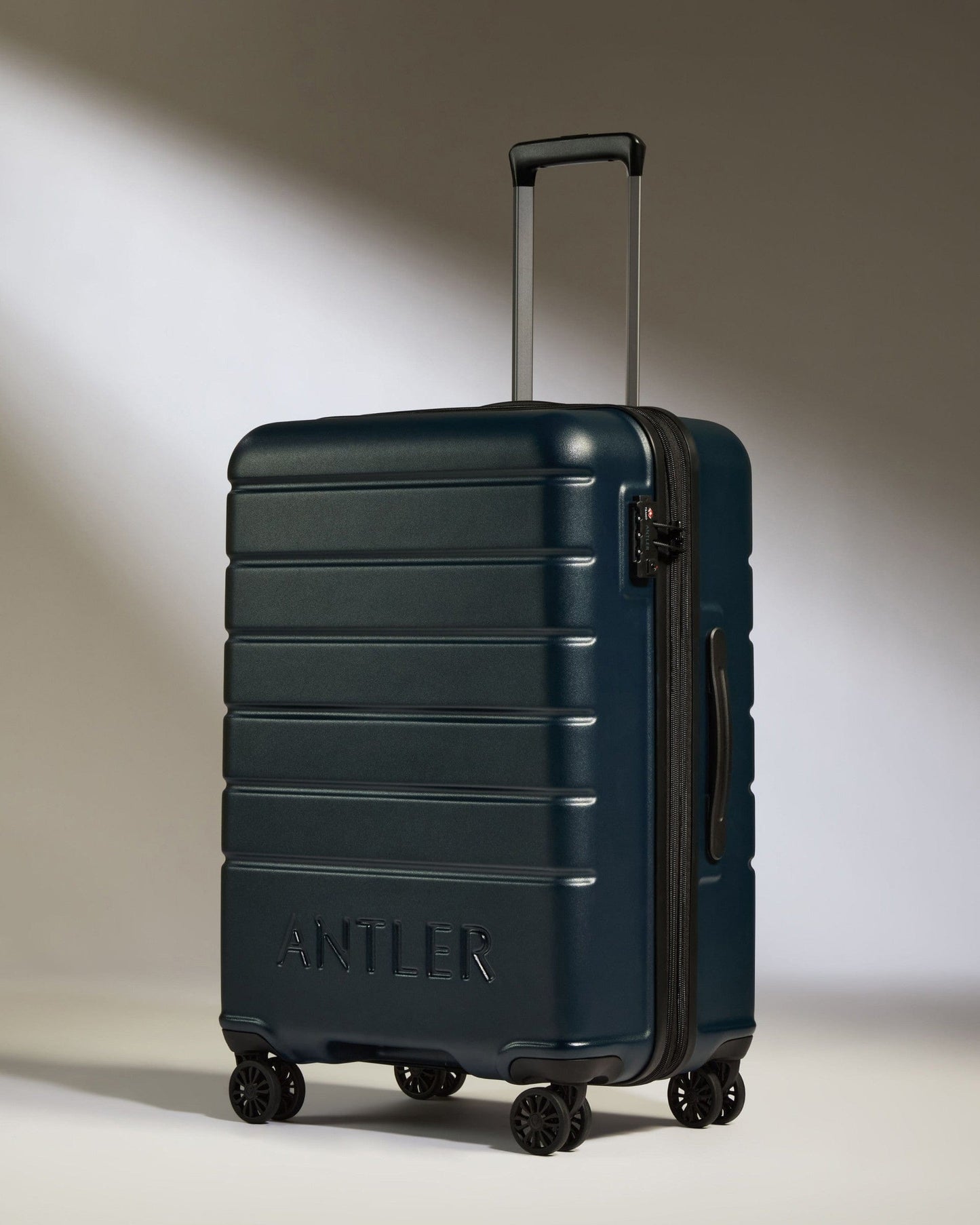 Antler Luggage -  Medium Suitcase in Midnight Blue - Logo - Hard Suitcases Medium Suitcase Midnight Blue - Logo | Lightweight Hard Shell Luggage