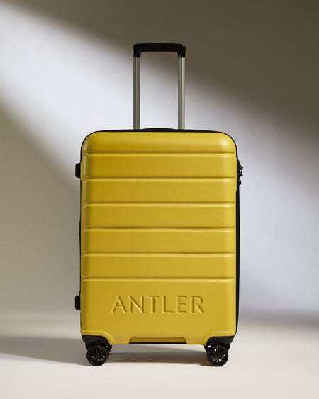 Antler Luggage -  Medium Suitcase in Mustard Yellow - Logo - Hard Suitcases Medium Suitcase Yellow - Logo | Lightweight Hard Shell Luggage