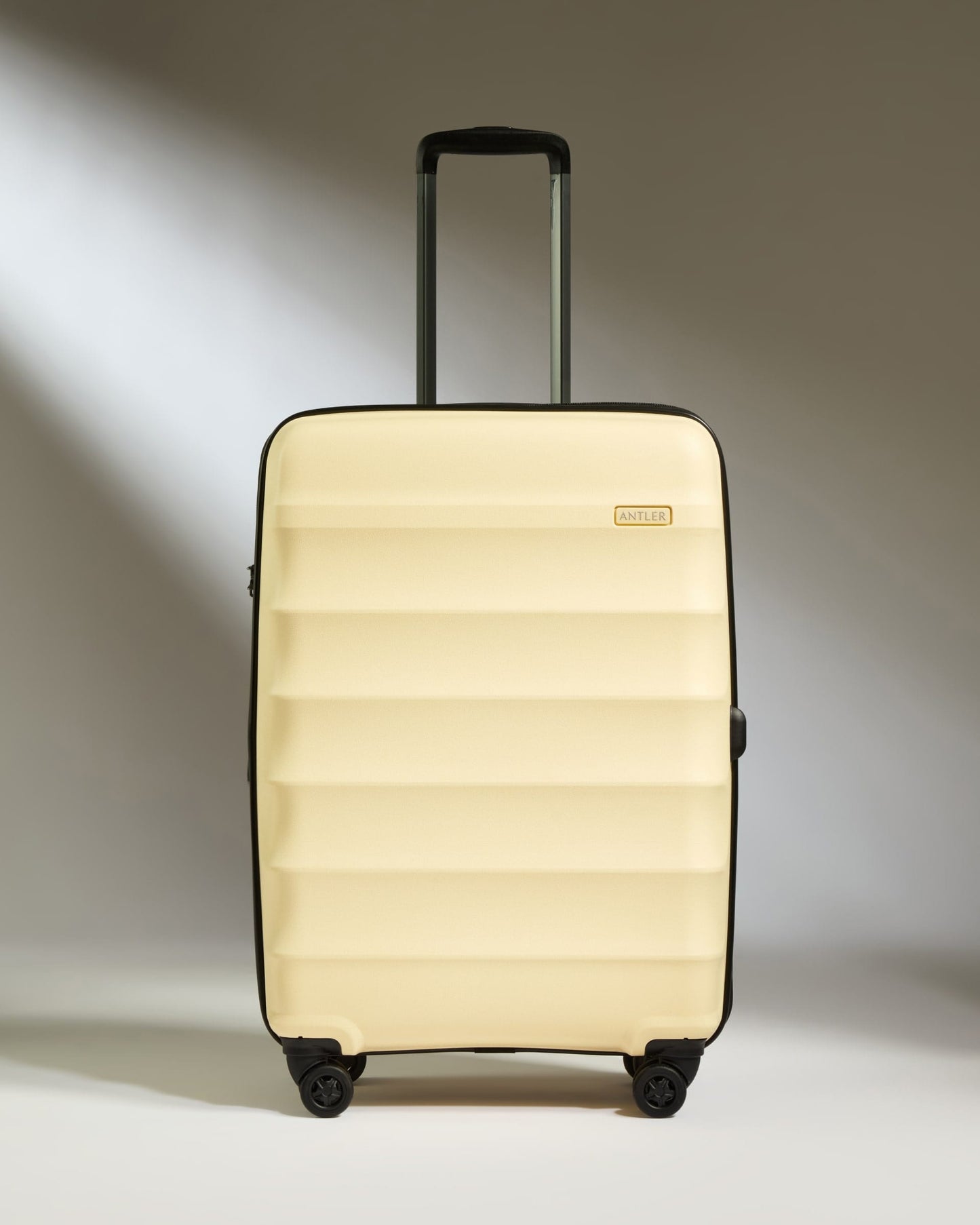 Antler Luggage -  Medium Suitcase in Pale Yellow - Juno - Hard Suitcase Medium Suitcase in Yellow - Juno | Checked Luggage & Medium Suitcases