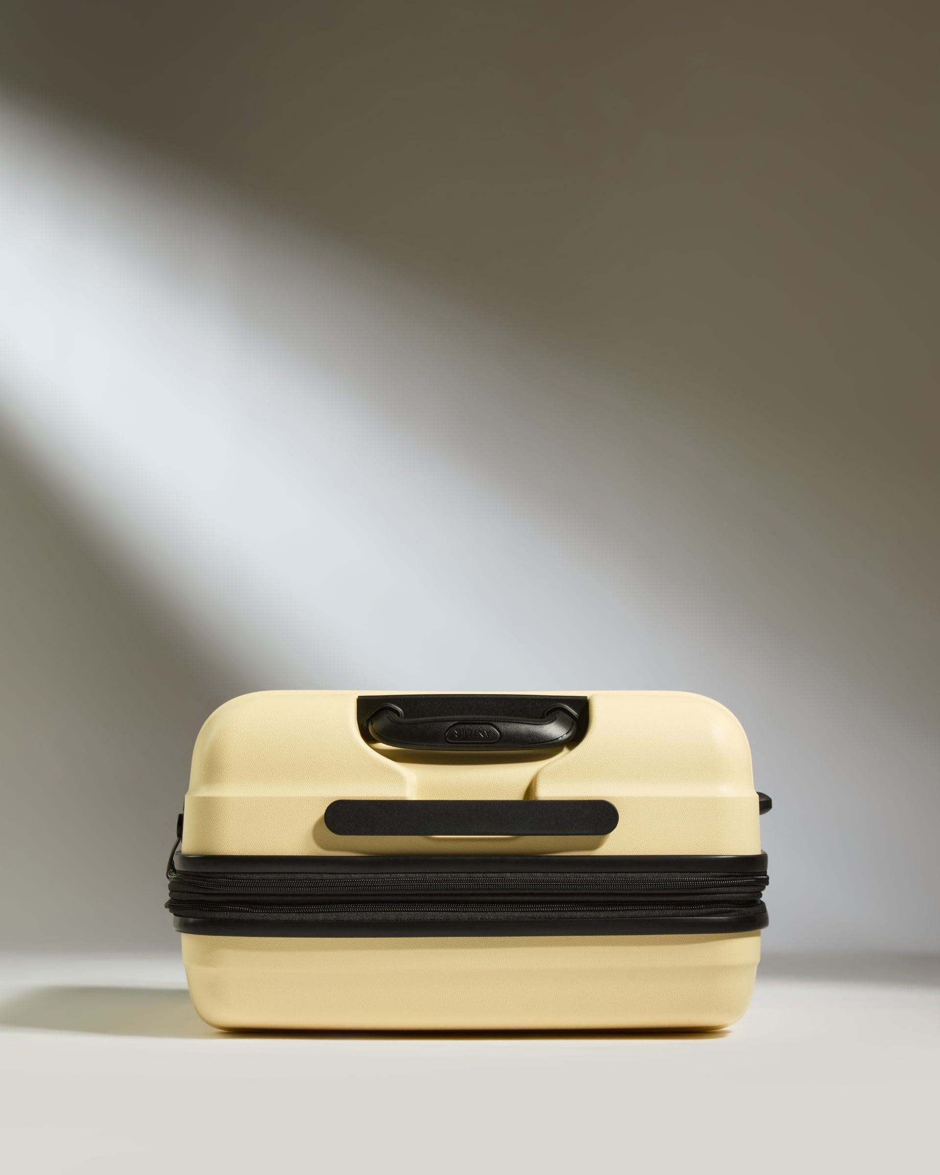 Antler Luggage -  Medium Suitcase in Pale Yellow - Juno - Hard Suitcase Medium Suitcase in Yellow - Juno | Checked Luggage & Medium Suitcases