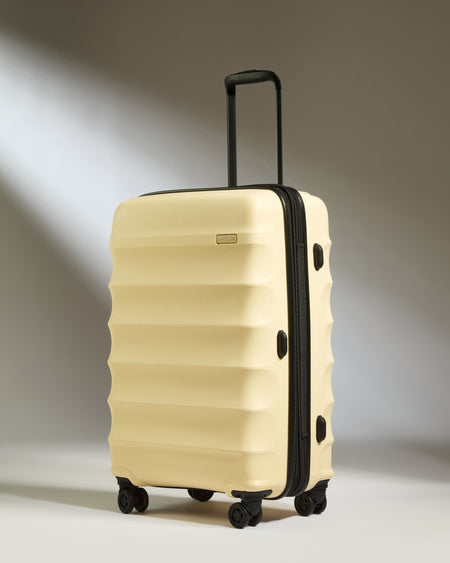 Antler Luggage -  Medium Suitcase in Pale Yellow - Juno - Hard Suitcase Medium Suitcase in Yellow - Juno | Checked Luggage & Medium Suitcases