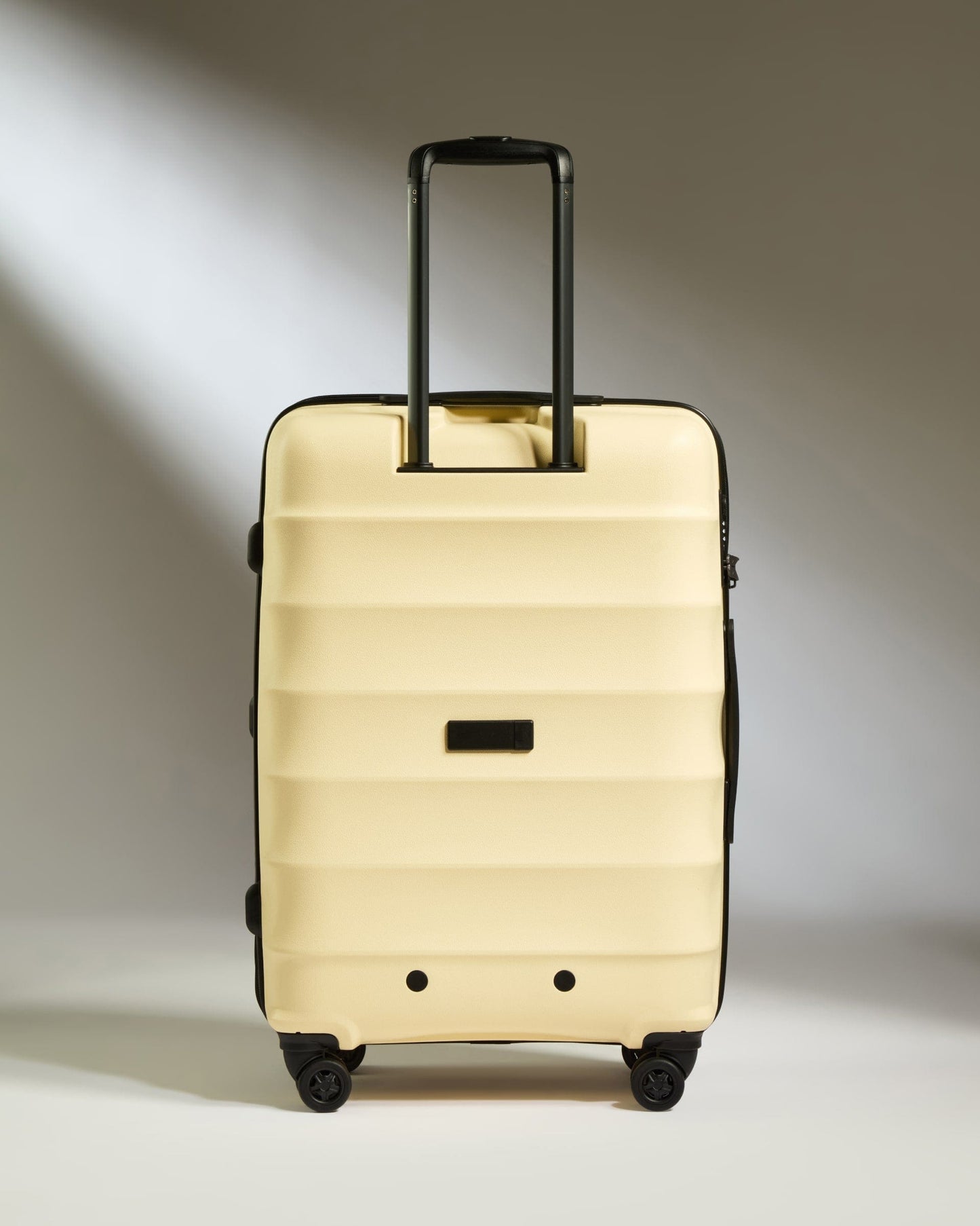 Antler Luggage -  Medium Suitcase in Pale Yellow - Juno - Hard Suitcase Medium Suitcase in Yellow - Juno | Checked Luggage & Medium Suitcases