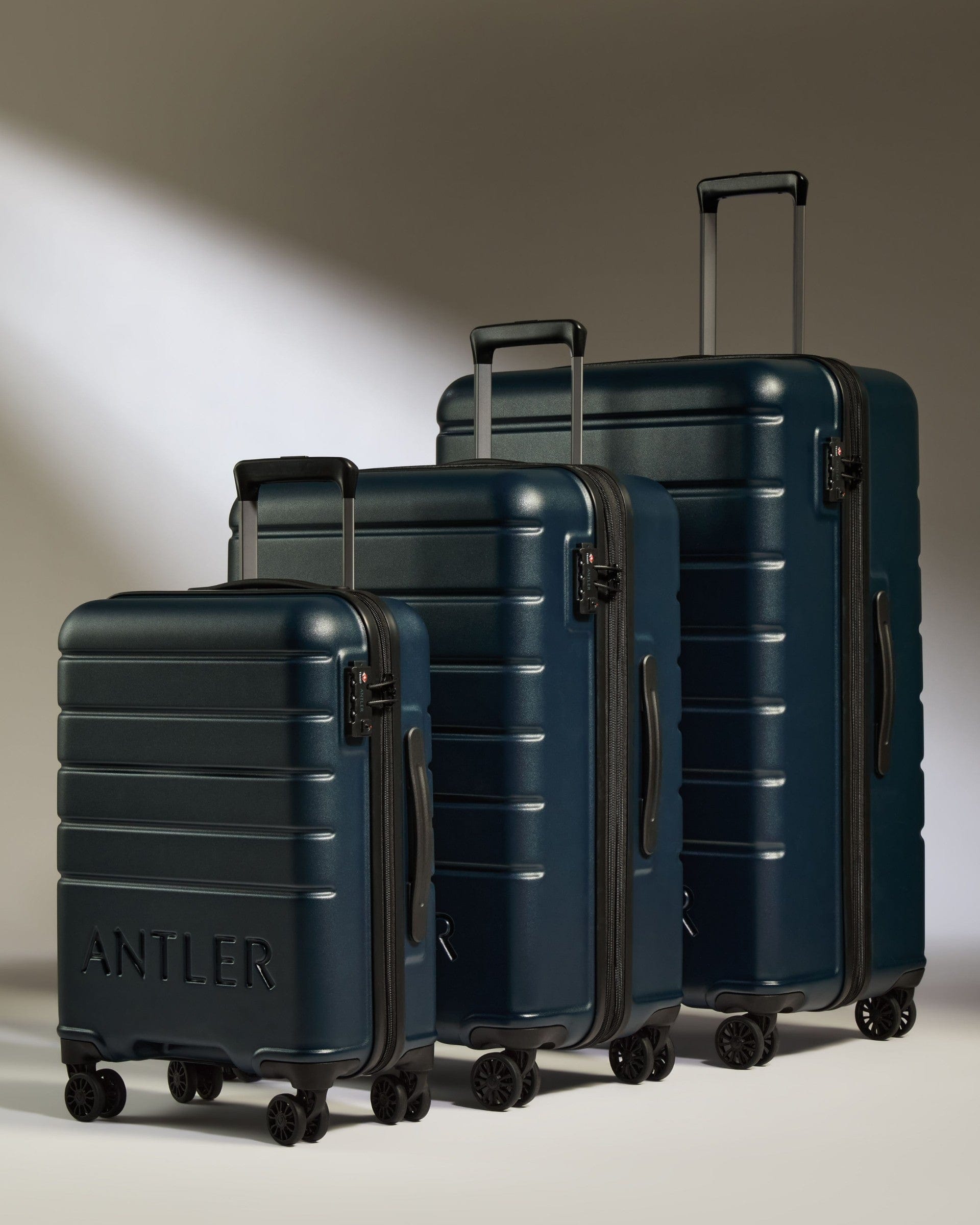 Antler Luggage -  Suitcase Set in Midnight Blue - Logo - Hard Suitcases Suitcase Set of 3 Midnight Blue - Logo | Lightweight Hard Shell Luggage